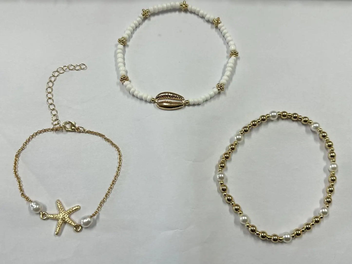 Correntes de tornozelo de férias de praia estilo boêmio feminino acessórios de pé de três camadas com pérolas de arroz conchas e estrelas do mar